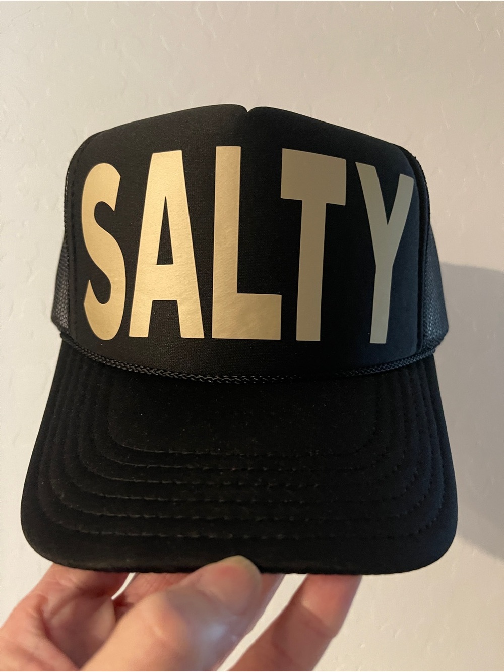 SALTY Black Trucker Hat with Gold Lettering